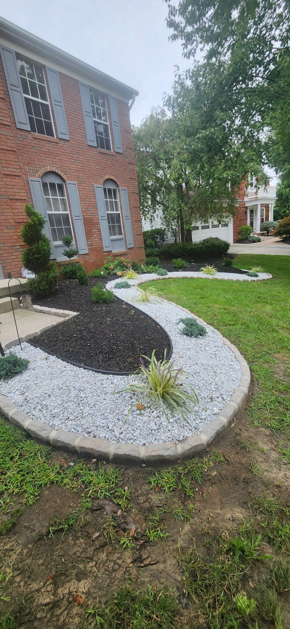 Decorative stone and gravel landscape bed