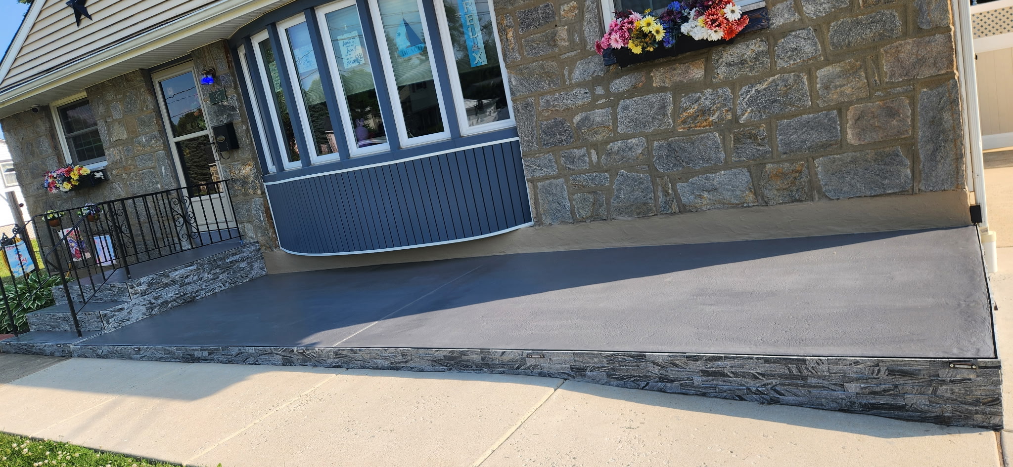 Concrete front porch and walkway with stone veneer